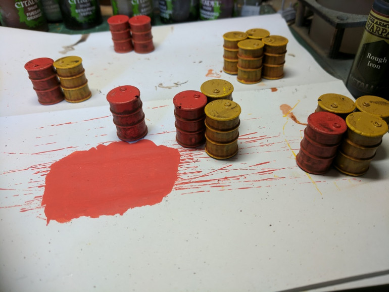 I wanted a bit of variation so I did 20 barrels and painted 10 yellow and 10 red, the base coat for the yellow was more of a brown ochre spray paint while the red was just a standard hot red, The base coat was followed by a wash of agrax earthshade and/or strong tone from army painter and then finally drybrushed.