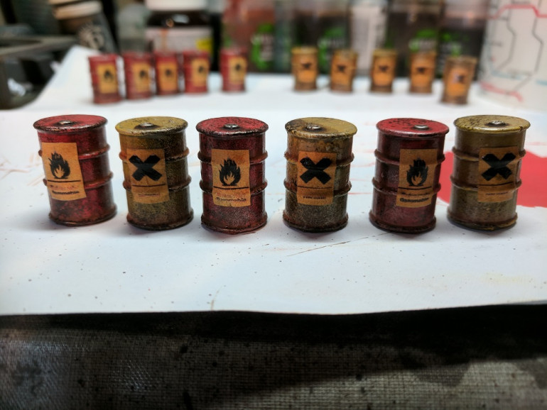 As an extra touch i printed off some hazard labels on standard printer paper and applied them to the barrels using PVA (don't add water to the mix. it ruins the prints) i used two standard hazard warnings, Irritant for the yellow and naturally the red barrels were flammable/explosive.