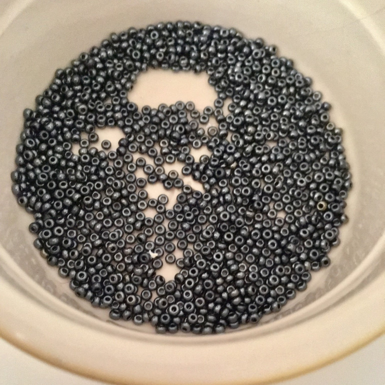Pour your rivets (tiny beads) into a pot so you can keep them in one place
