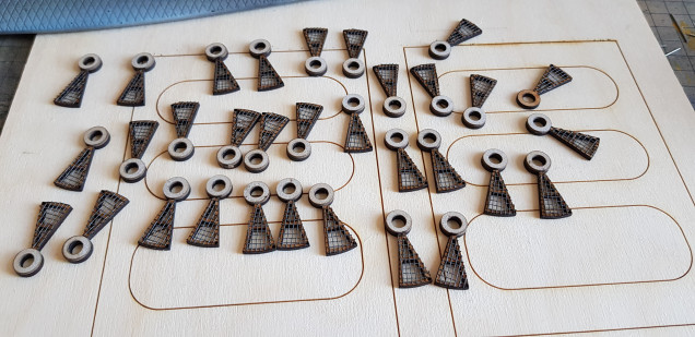 I then laser cut the 100 parts again to make it and came up with a cunning plan. Better than my last nights games of infinity which I lost. These subassemblies were done with superglue and each one sanded down to between 2.95 and 3.00mm I then cut paperclips into 19mm strips and glued them into the cut holes. 