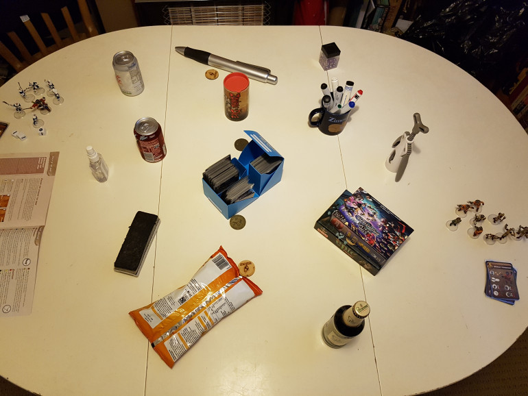 The table setup, before deployment.  The Gremlins portal is the cork screw as it is mechanical, and the Liliputians will use the pot of hand sanitiser as good hygiene is a form of order and I had no better ideas.  Shut up, ok?