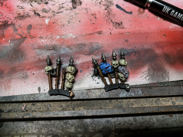 I first thought the spikes were metal but looking at them now i can see the top of one appears to be splintered and studs are present in a few of the poles (no doubt a Slaanesh fashion statement) so i decided to give them a brown colour, rhinox hide followed by some gorthor brown followed by a wash of agrax. Skulls were layered with ushbiti bone, helmet done with Ultramarine blue and the genestraler skull in Slannesh grey