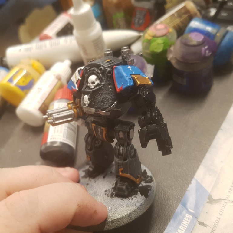 Brother Chaplain Ritter Had Two Assault Cannons taken from Dark Vengance Terminators (Counts as a single High Powered Assault Cannon in Game) and his Left Arm is a Contemptor Dreadnoughts Leg Stripped and Turned Upside Down with a Standard Dreadnoughts Weapon and Stormbolter Taken from a Kit we'll look at in a Minute.