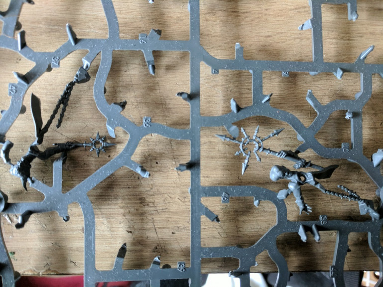 Seeing as this project is all about spring cleaning i figured this would be a good time to use some of the extra bits from the Blackstone Fortress model sprues. Two of the remaining pieces are perfect, a set of chaos icons to use on the base.