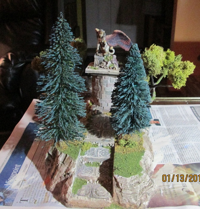 Front view showing angled trees and available space for models both on the piece and beneath the boughs on the tabletop.