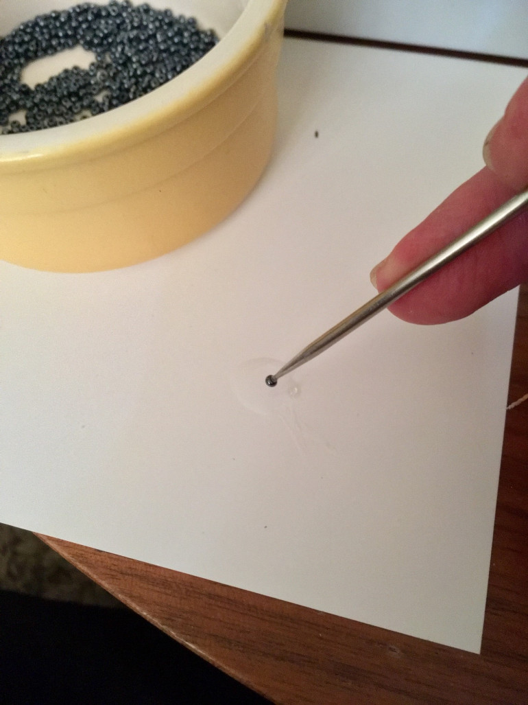 Pour some superglue onto a non-absorbent surface. Citadel palette pad is great. Use a cocktail stick to pick up a bead and touch it to the glue