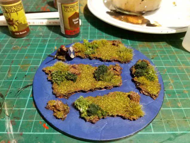 I added the foliage next which comprised of some summer flock and a few different colors of clump foliage I had kicking around.  You'll also notice a hidden kitbash soldier too here, he was made from frostgrave and perry spares 