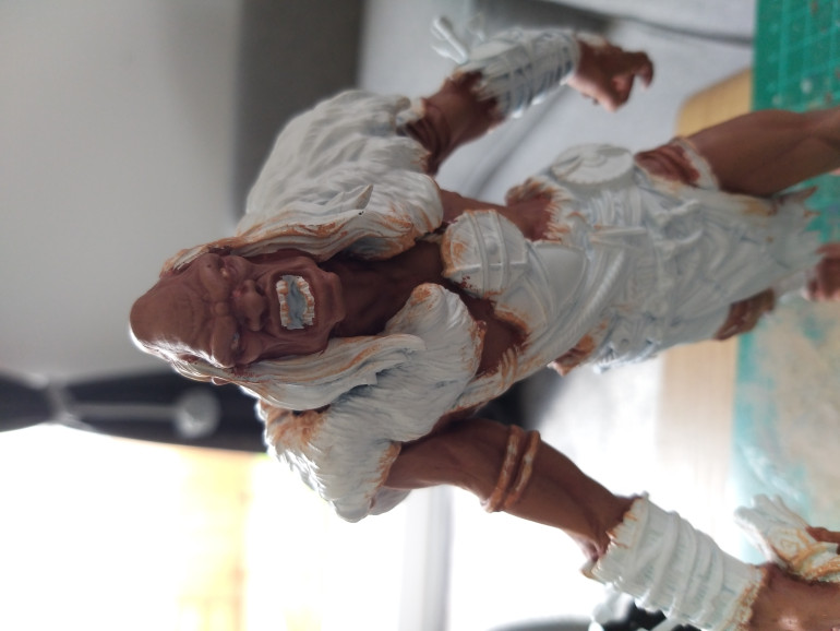 I highlighted the raised areas with Cadian Fleshtone to give it a little more definition