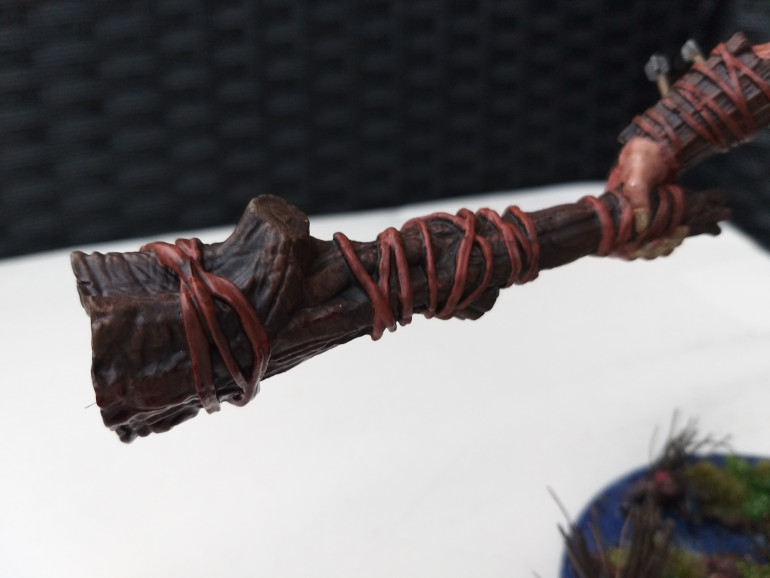 His club was again painted with browns, moving from a base of a dark brown and drybrushing lighter browns on top. Finally the leather was done in a redish brown to stand out