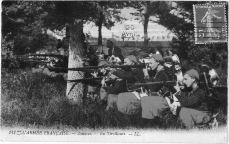 Infantry of the Tank Corps (Tank Regiments Maintain an Infantry Company Dressed in a Black Tunic and White Pants) Pose for a Postcard Photograph. 