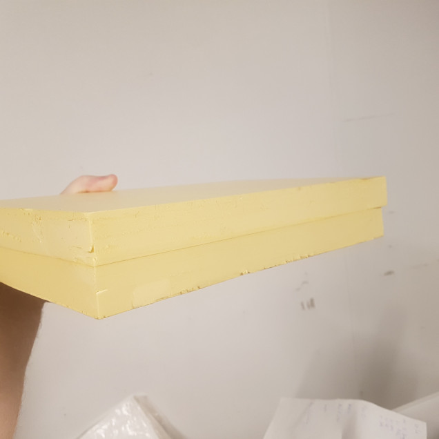 A Rough Rectangle of Foam was Cut once the Two Had Dried