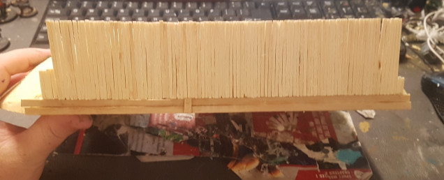 Going Back to The Hobbit Hole. Two Coffee Stirrers Were Glued in Place to Give me a Solid Base to Work from Rather than  Ragged Cut. Then Small Square Wood Was Glues in Place. Only the End were Trimmed to any Degree Because they Tilted when Attached as a Whole.