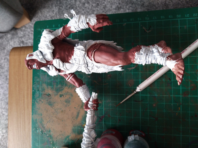 Next step was the model itself, I started by undercoating him white. The skin tones were next, based with Bugmans Glow