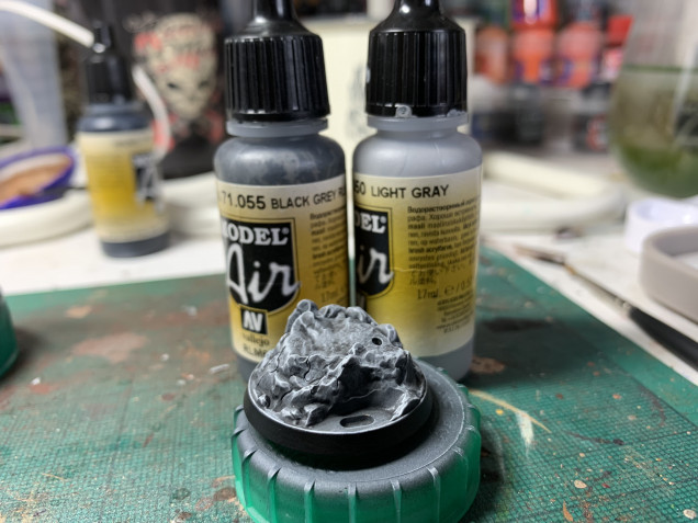 Simply a nuln oil wash over the zenithed base and a drybrush of grey.