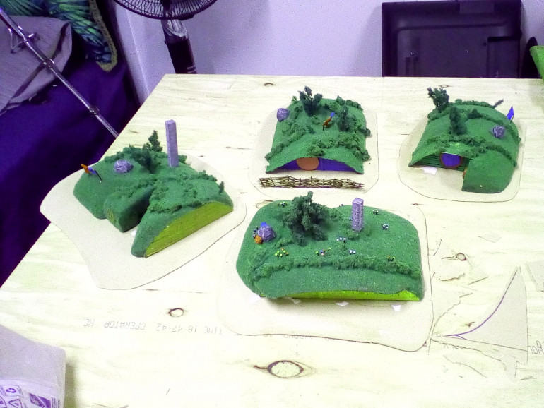 All the Hobbit Holes are Glued to their Bases. They Have Since been Based with Sand.