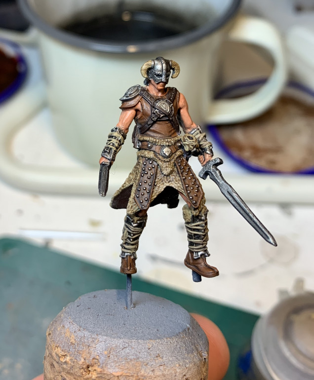 Other details added using the same palette. Highlighting was a matter of getting the small brush onto the details. Same palette. Used some Rakarth Flesh to make lighter shades of brown for the tunic 