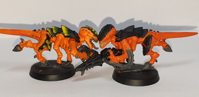 Mixed a little Mephiston red into TrollSlayer orange to darken it down a bit.