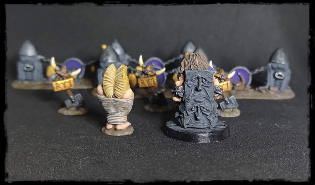 A little more terrain (in the background) and two prisoners. I absolutely love the one chained to the unhappy throne. That throne is just so amazing.  And incredibly easy to paint.