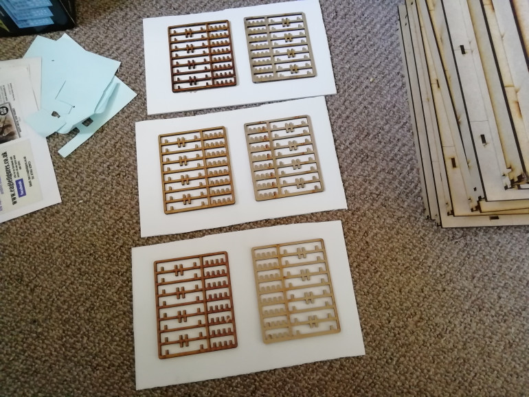 I saved some old srues from an MDF kit and used them as patterns for the walls.