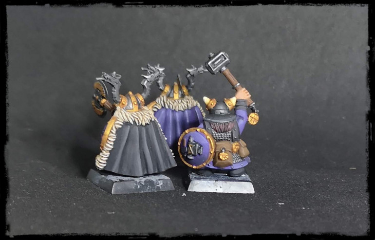 One new general (the old one is in the background). I gave this one a black cloak instead of a purple, so they're easy to distinguish on the table. Also a hammer-time dude. Since he's the only one with a hammer, I chucked him in with the generals.