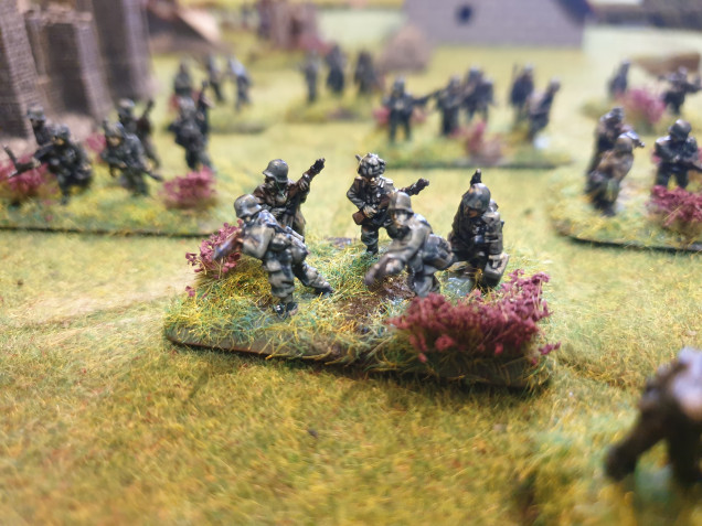 The Panzergrenadiers followed by Halftracks