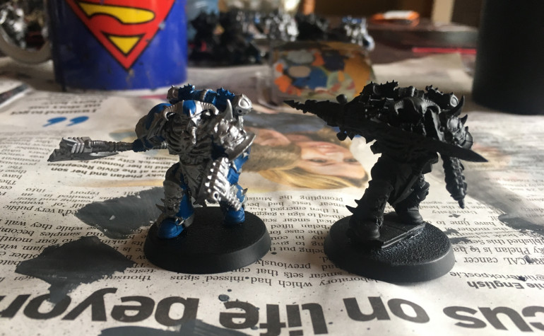 Power Weapon Chosen: One standard with power axe, the other with a Power Sword from the Chaos Lord from the same set (Dark Vengeance)