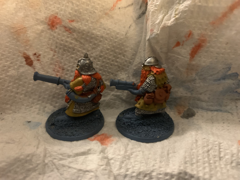 Worn under the chainmail on the left hand figure and over the chainmail on the right hand figure.