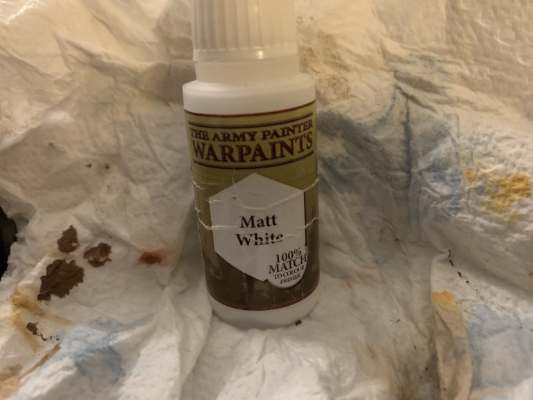 Army Painter Matt White for the wizard’s beard and the fletching (feathers) of the crossbow quarrels. 