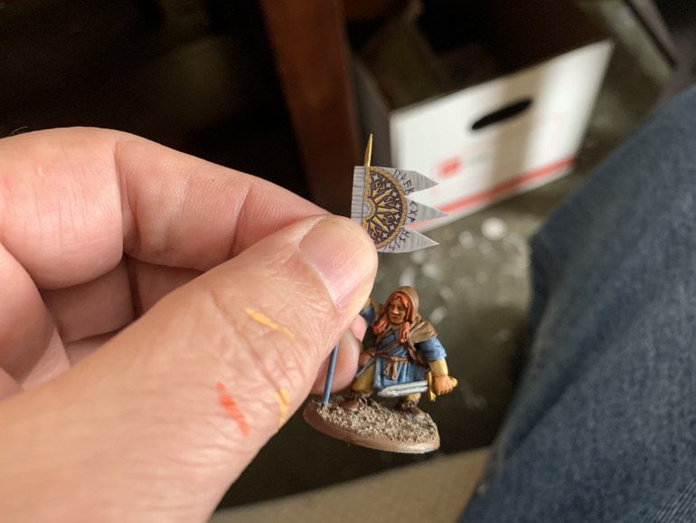 Pre-form the transfer by wrapping it around the banner pole.