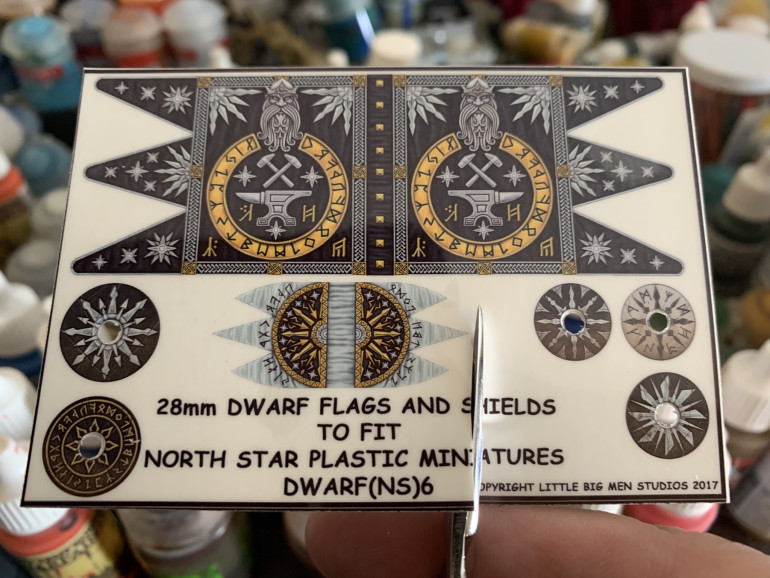 Cut out the banner you intend to use. Don’t worry about trimming it closely, that’ll come later.