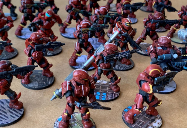 Pretty much all these guys were primed and re-painted entirely to make them more or less match, or at least look like they might belong to the same force.  Weapons were also switched around, armor enhanced in some cases, etc. 