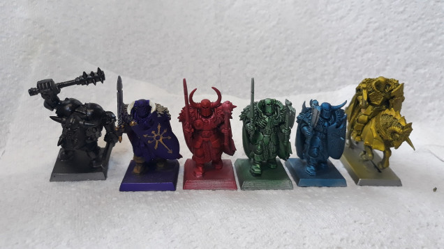 Examples left to right - Vallejo Game Ink Black; Vallejo Game Ink Purple (apologies this guy is already part-way through his paint job..), Vallejo Game Ink Red, Army Painter Green Tone, Army painter Blue Tone and Vallejo Game Ink Yellow