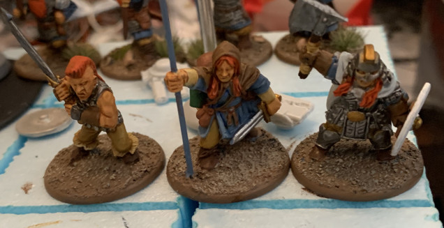 These figures are from Bad Squiddo Games. The figure holding the banner pole is a conversion of the torch bearer figure. 