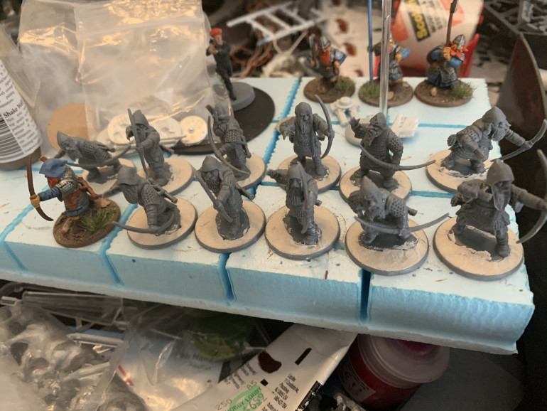 I built these by first gluing the bodies to the bases, then adding the left (bow) arms, then the right arms then adding the heads afterwards. I let all of those parts dry and then added the quivers last. Once that was done, I filled in the bases with base render. 