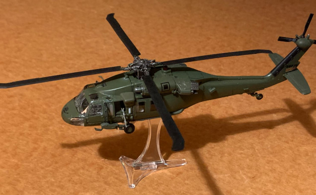 UH-60 Blackhawk, 1:72 scale (20mm), 9 inches long.  Die case from Forces of Valor.  Touched up some chipped paint and re-attached door guns that were either bent or broken off.  Also reinforced the flight stand's attachment point to the underside of the fuselage.