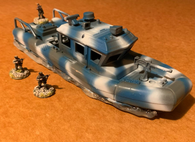 This one's going to take a while.  But after 22 months in limbo, she's finally underway.  Primed a dark gray.  Then airbrushed ocean blue and light gray for a modern maritime camo effect.  