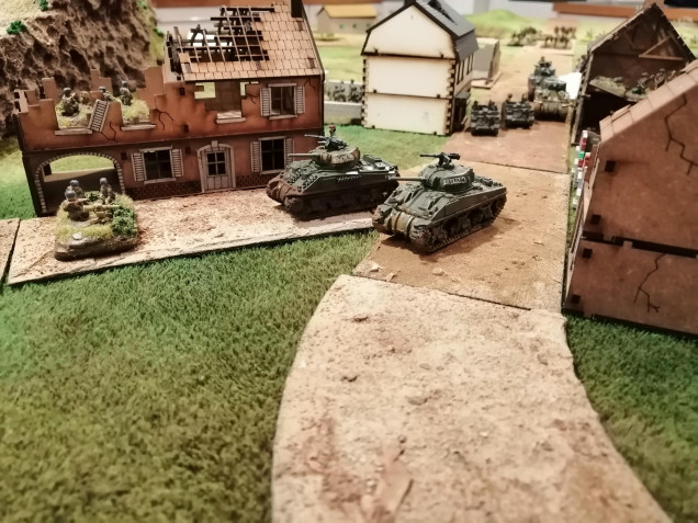 Tank Platoon 2 round the corner to deal with the 7.5cm Infantry Guns