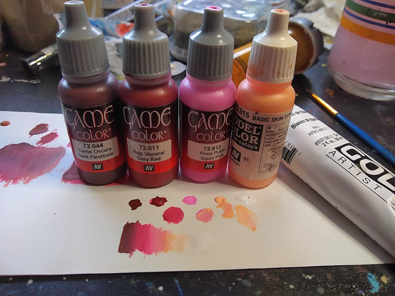 Skin paints. Note the tube of white on the right side.