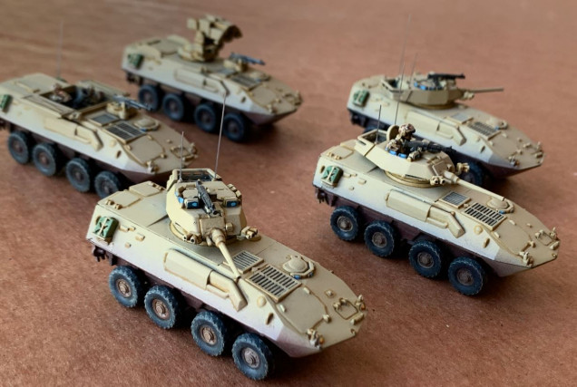 Just the LAV-25s - drybrushing added, especially around tires, two antennae added per vehicle on the 25mm turrets, one for the ITV and mortar).)