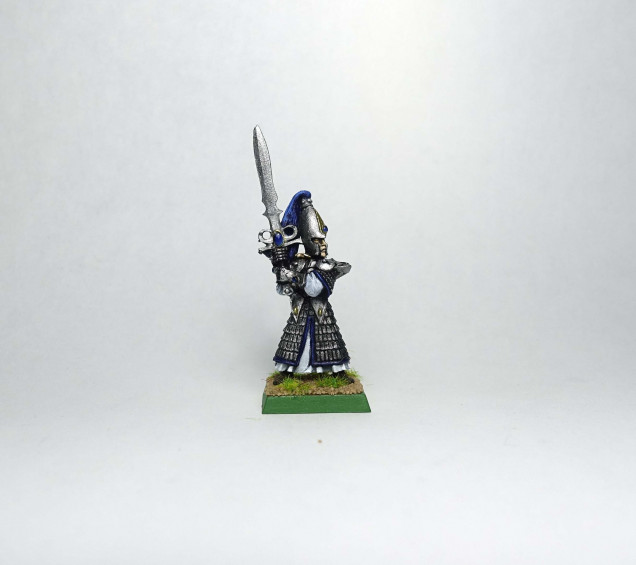 I found a lone sword master from the time I painted my original army and painted it up.