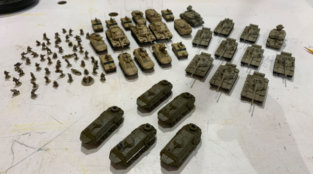 BTR-60s are now built, alongside the pre-existing T-54/55/Type 59-IIs, and my completed USMC 1991 Desert Storm force to the upper left.