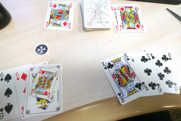 The next top card was a King. So only an Ace (face cards count as 10 for this), or face card or a joker can be played. 