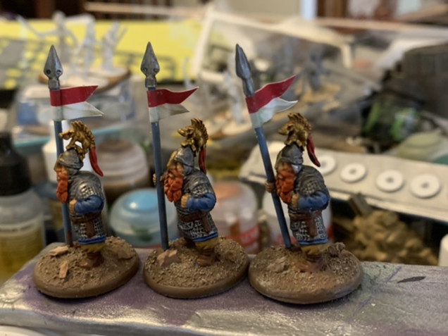 Added some pennants from Flags of War to mark out unit leaders. Saga doesn’t use them but Lords of Erehwon does. I cut the pennants out with some small scissors and the coated the backs with PVA glue and the wrapped them around the spear haft. 