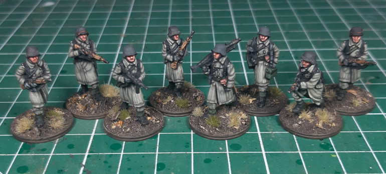 More in greatcoats...