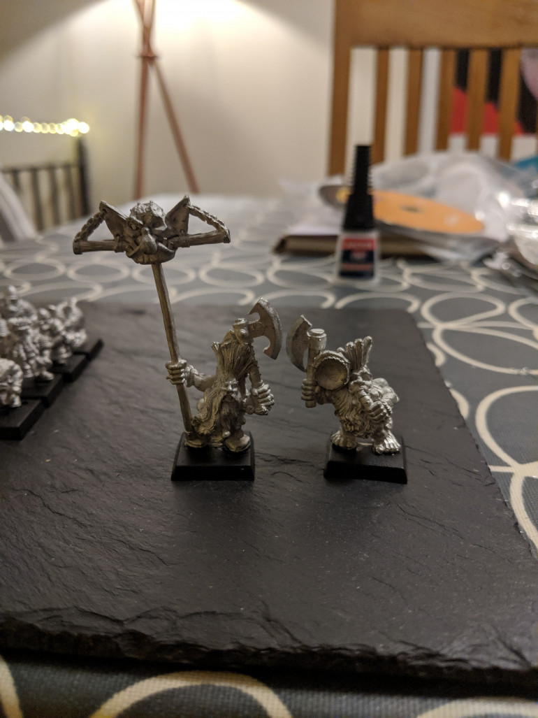 These two are old GW slayer command models I believe. 