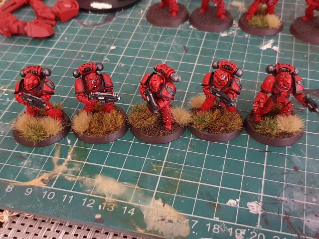 These were all painted slightly differently. Some are a slightly brighter red than the others but otherwise its hard to tell.