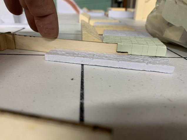 This MDF gauge is what is used to slice the hexes to their proper size. My plan is eventually to make stone walkways with grass on both sides and to do that, I need to see how tall the plaster walkways are when compared to the height of a half height hex. Close enough for my liking. Check 2.