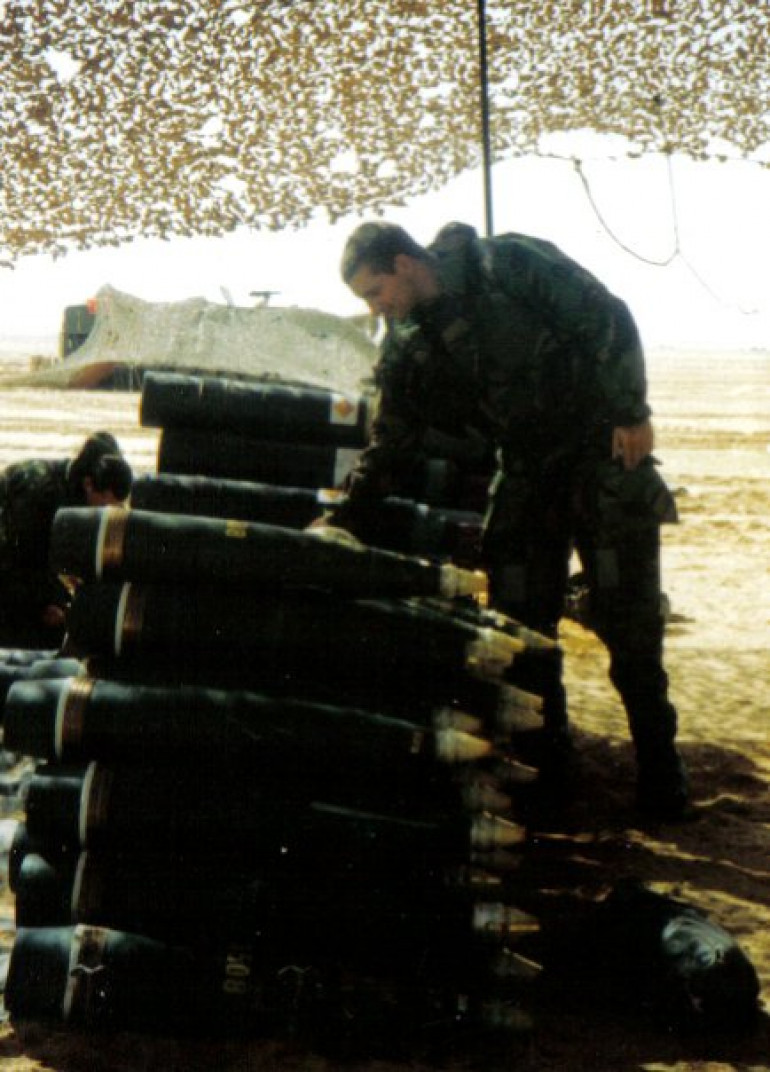 Checking our rounds before a fire mission 