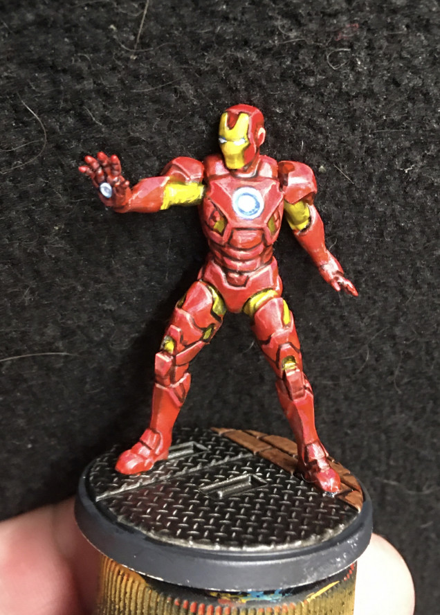 I'm not completely over the moon with my job on Ironman. I initially tried inks over bright silver for a metallic sheen and I wasn't pleased with that. Then I went through and edge highlighted and that felt too extreme. So I put a wash over that to tamp it down. I suspect this will end up, eventually, pushing me towards some NMM. The saving grace here is his glowing parts. It turns out that the eyes really sell him (although his left eye doesn't show up well in the photo). 