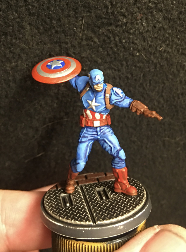 Still some work to do but I'm really happy at how he's coming along. Just threw inks over bright silver for the shield and did a silver star on his chest. More movie Cap than comic.